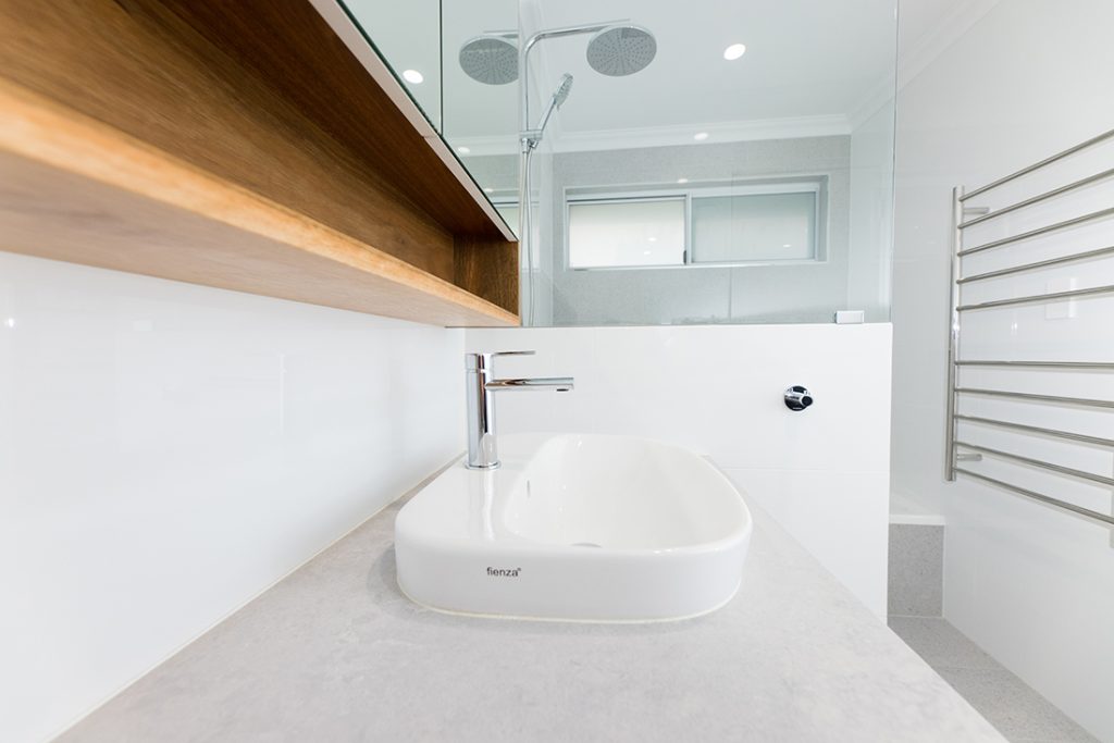 Bathroom sink on a vanity renovated by WA Assett