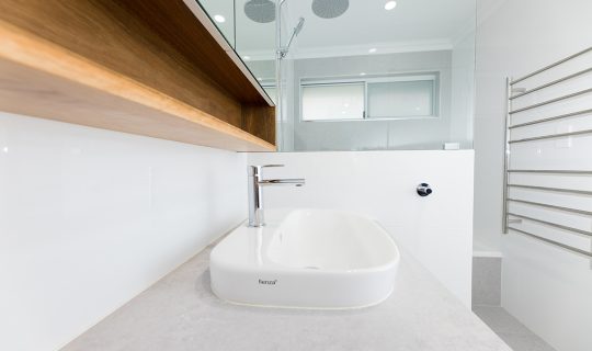Bathroom sink on a vanity renovated by WA Assett