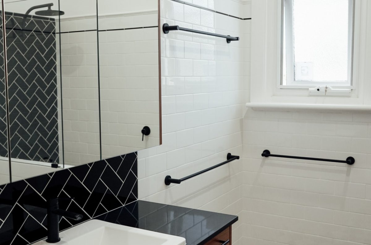 white and black with timber detailed small bathroom