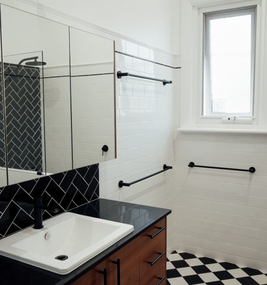 white and black with timber detailed small bathroom