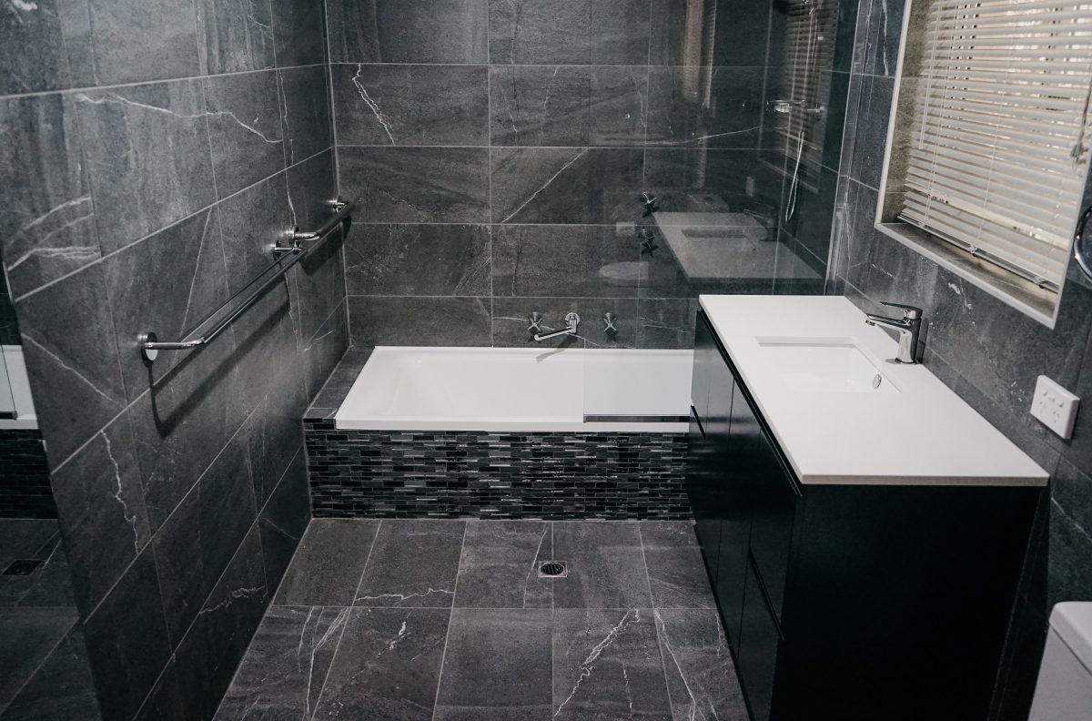 dark tile detail in small modern bathroom renovation