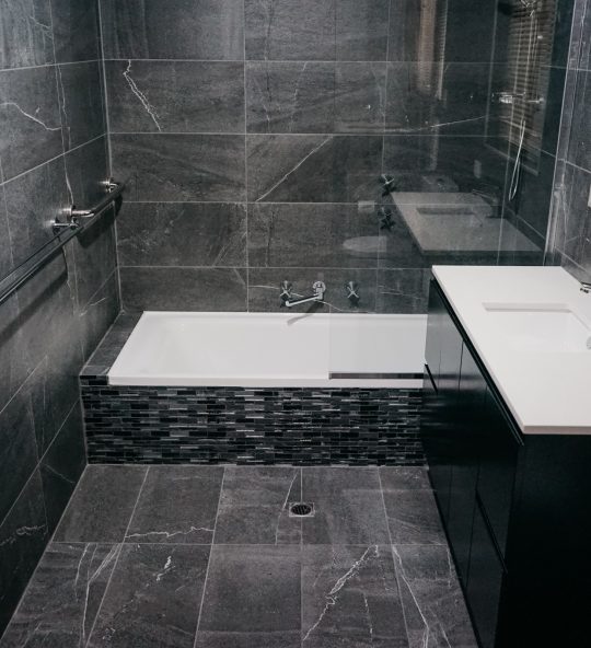 stunning dark tile detail in modern bathroom