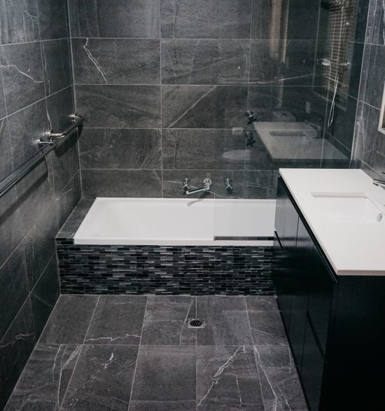 dark tile detail in small modern bathroom renovation