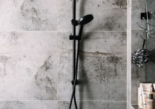 modern black shower head with tiles