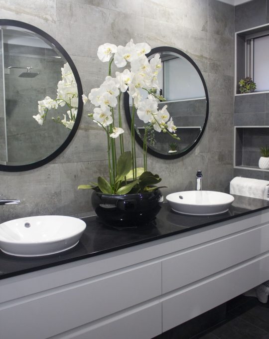 double bathroom basins with orchids