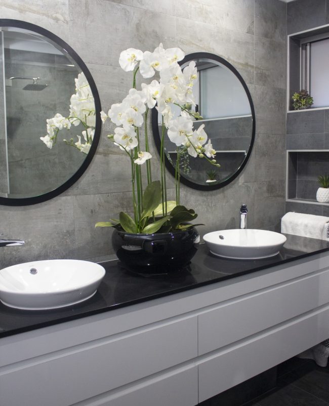 double bathroom basins with orchids