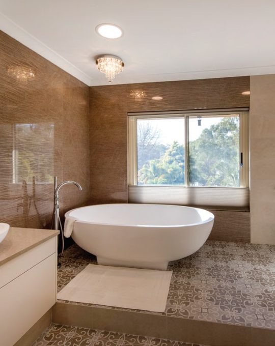award winning bathroom renovation with natural light, large white bath