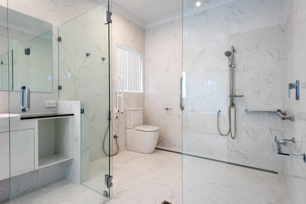 large shower area with toilet