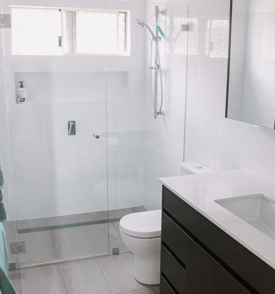 Small bathroom with a modern vanity and shower