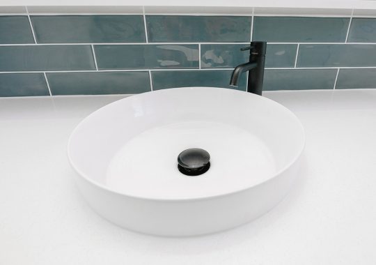 modern sink with black tap