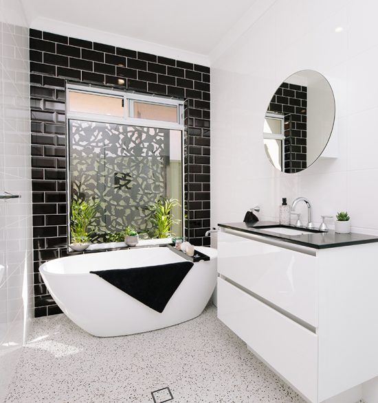 modern black and white tiled bathroom small