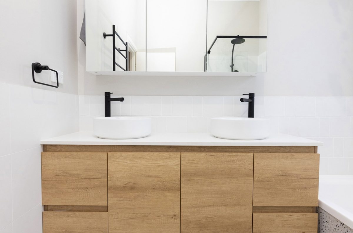 WA Assett Wembley - 022 Bathroom renovation, vanity with two sinks and a mirror above it.