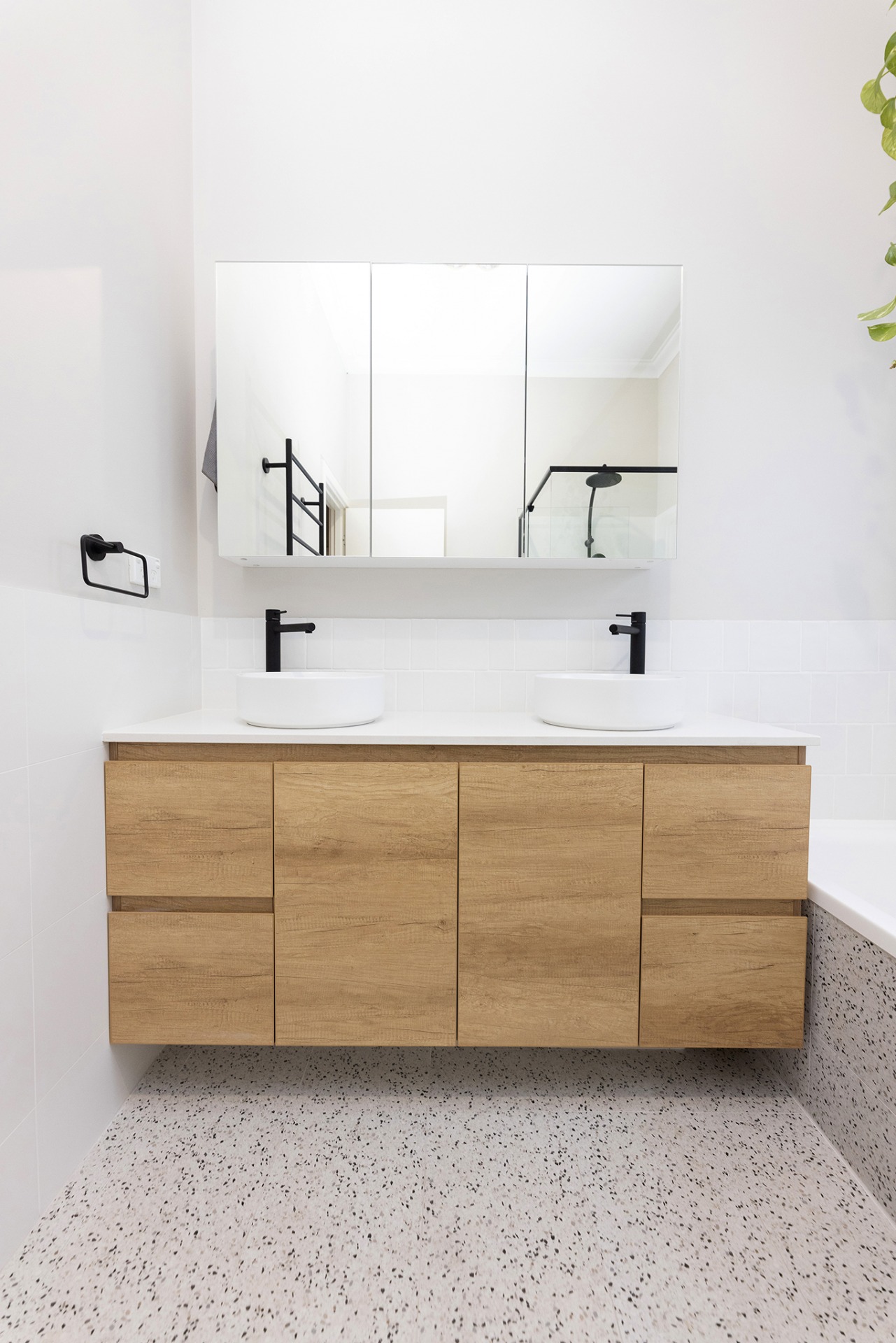 WA Assett Wembley - 022 Bathroom renovation, vanity with two sinks and a mirror above it.