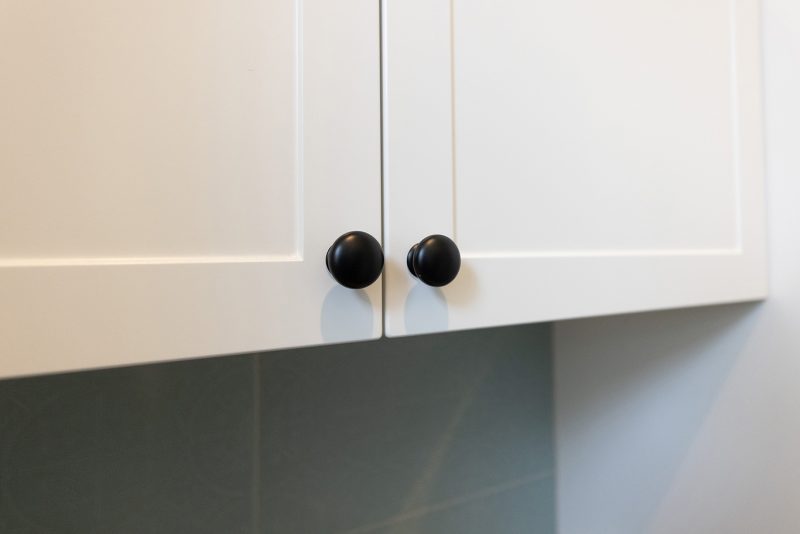 White cupboards with black finishings