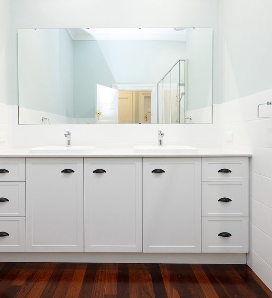 Wide vanity with square mirror above