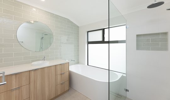 Large bathroom with wide vanity and spacious walk-in shower