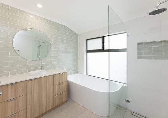 Large bathroom with wide vanity and spacious walk-in shower