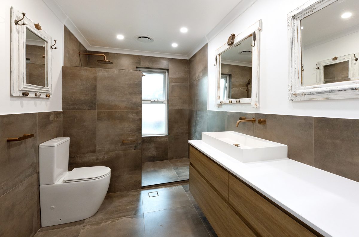 WA Assett bathroom renovation with smooth darker textures mixed with white and vintage worn mirrors