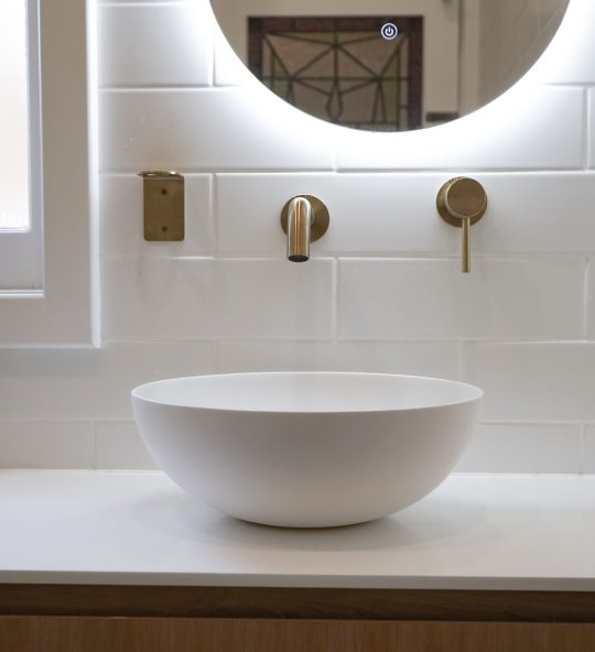 Nedlands Carrathurs bathroom renovation, white basin and golden basin mixer tap.