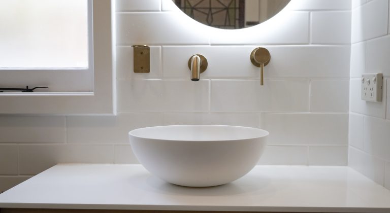 Nedlands Carrathurs bathroom renovation, white basin and golden basin mixer tap.