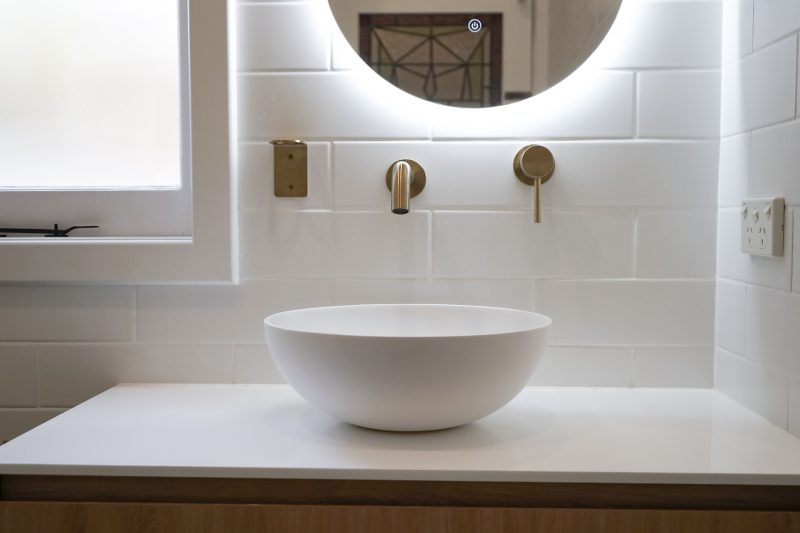 Nedlands Carrathurs bathroom renovation, white basin and golden basin mixer tap.
