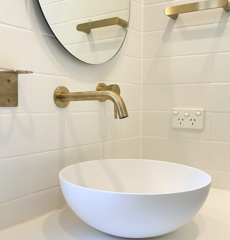 Nedlands CARRATHURS - 48 bathroom renovation, white basin and golden basin mixer tap.
