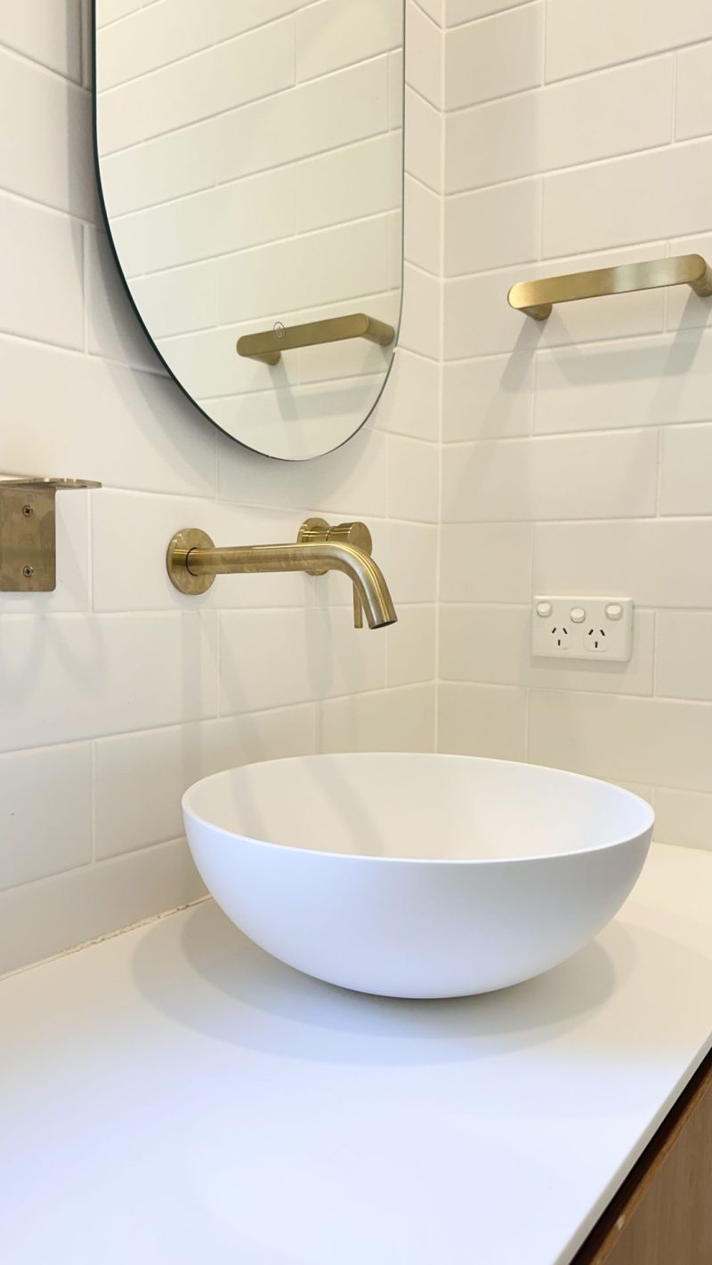 Nedlands CARRATHURS - 48 bathroom renovation, white basin and golden basin mixer tap.