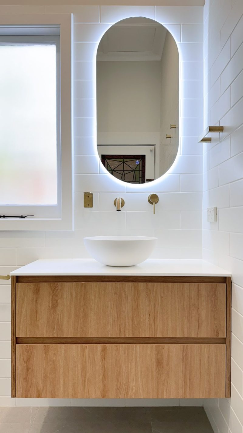 Nedlands Carrathurs bathroom renovation, illuminated mirror and white basin.