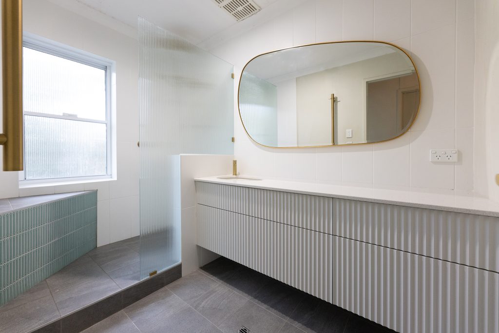 grey bathroom paired with colour - wa assett
